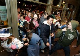 consumers burst through doors as Alderwood Mall opens up at 12:01 a.m. the day after Thanksgiving for