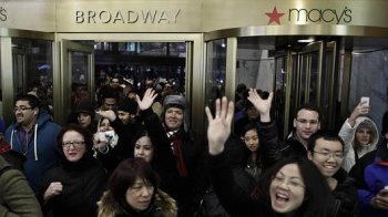 individuals enter Macy's Herald Square once the shop starts its doorways at 8 pm Thanksgiving day on November 28, 2013 in nyc.
