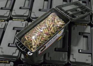 Plano ammo can filled up with 9mm rounds sitting on a pallet of various other cans.